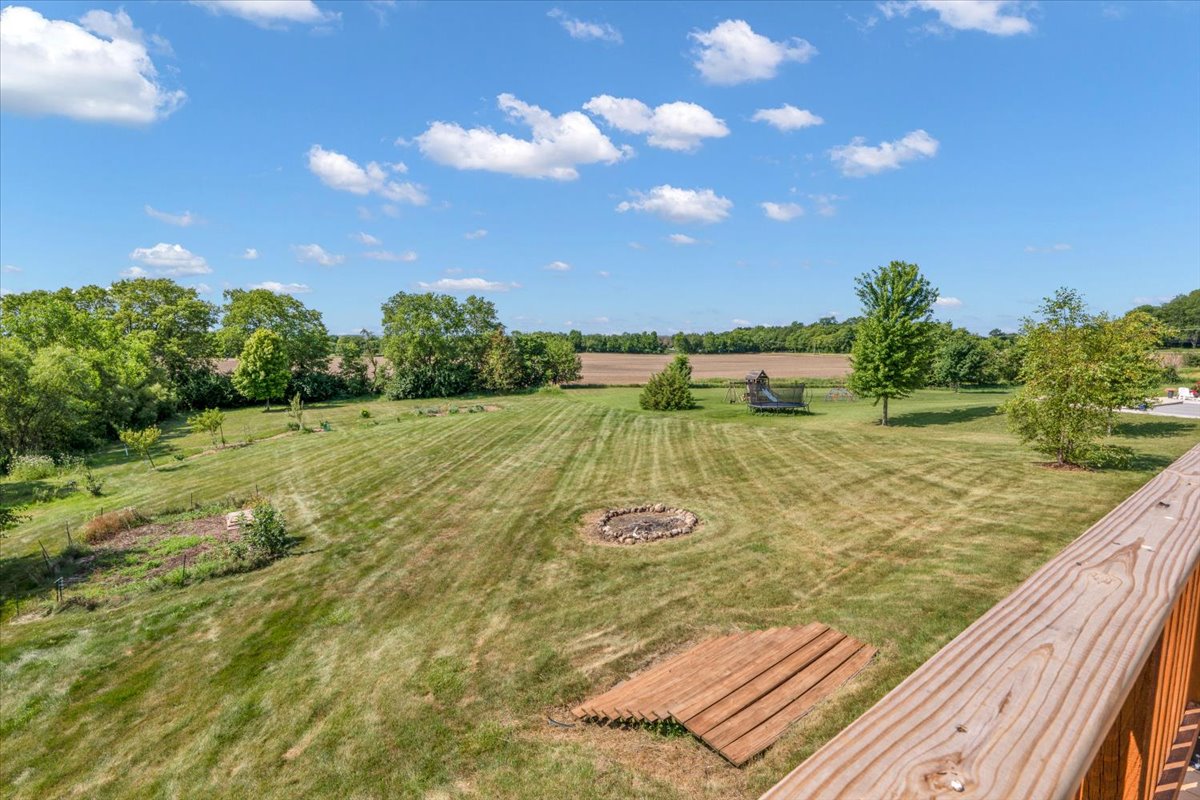 Rear grounds, garden beds and fire circle