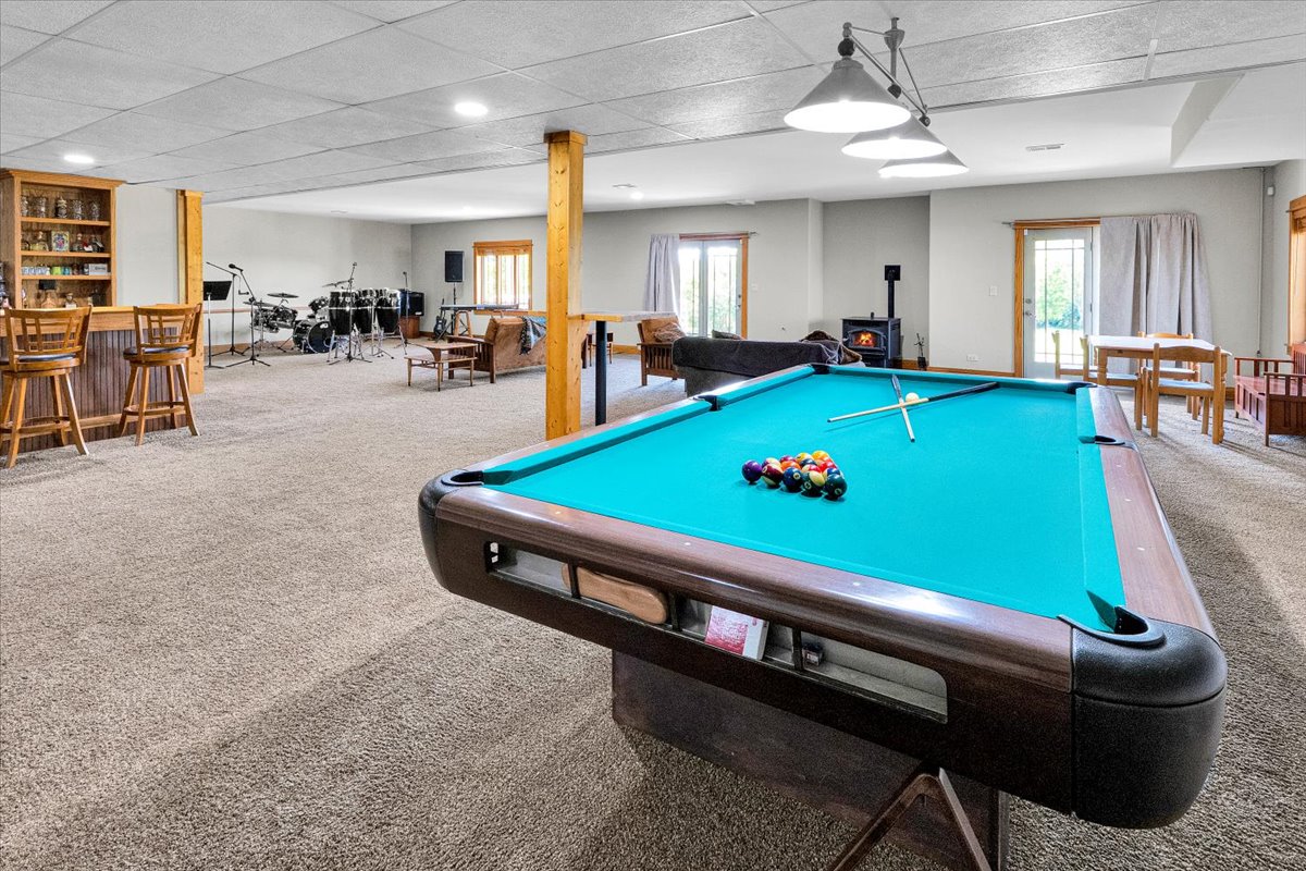 Lower-level recreation space with pool table and music area
